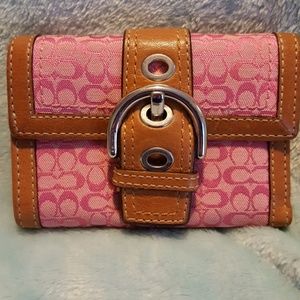 Coach leather and signature fabric wallet.